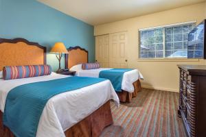 A bed or beds in a room at WorldMark Running Y