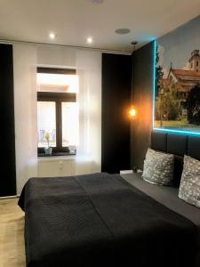 Postel nebo postele na pokoji v ubytování SALZHAUSBLICK BUSINESS APARTMENTS - Zentrale Lage am Salzhaus - MwSt-Rechnung verfügbar
