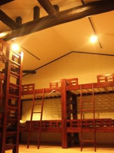 a room with two bunk beds in a building at Kyoto Guesthouse Roujiya in Kyoto