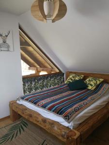 Säng eller sängar i ett rum på Leśna Ostoja