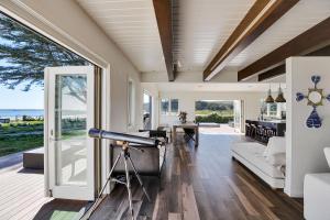 a living room with a view of the ocean at A little piece of heaven... in Half Moon Bay