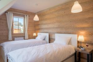 Posteľ alebo postele v izbe v ubytovaní Nydala Rustic
