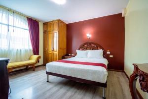 Voodi või voodid majutusasutuse Hotel Cumbayá Sanvy toas