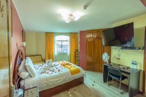 Voodi või voodid majutusasutuse Hotel Cumbayá Sanvy toas