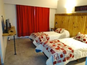 Postel nebo postele na pokoji v ubytování Hostal El Korú