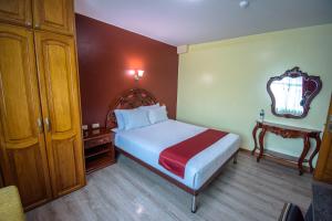 Voodi või voodid majutusasutuse Hotel Cumbayá Sanvy toas