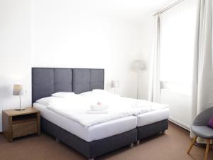 Posteľ alebo postele v izbe v ubytovaní Hotel U Brány