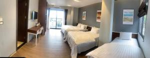Postel nebo postele na pokoji v ubytování Catba Buffalo Hostel