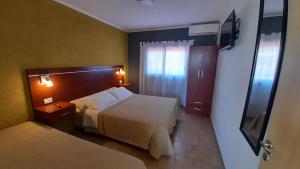 Ένα ή περισσότερα κρεβάτια σε δωμάτιο στο Amanecer Petit