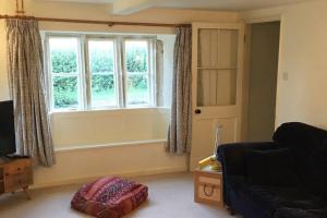 Istumisnurk majutusasutuses 16 Century Farmhouse Cottage, foothills of iconic Glastonbury Tor.