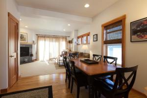 a dining room and living room with a table and chairs at Pet Friendly Venturi BBQ on the Deck in Hood River