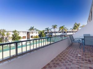 A balcony or terrace at 2 'The Dunes', 38 Marine Drive - pool, tennis court and so close to the beach