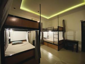 a bedroom with two bunk beds in a room at bititi dorm in Hoi An
