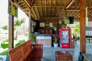 a restaurant with a red coke machine in a room at Balkondes Duta Menoreh in Magelang +22 photos