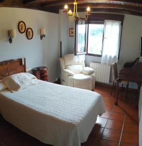 En eller flere senge i et værelse på Casa de Tata