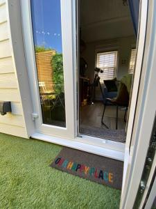 an open door with a view of a yard at OurStudio in Beverley
