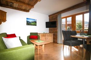 TV a/nebo společenská místnost v ubytování Haus Berge Appartements