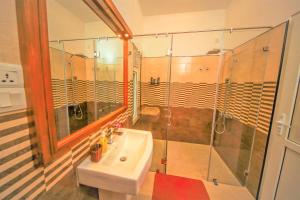 a bathroom with a sink and a shower at Y&Y Residence in Kandy
