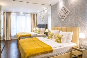 Posteľ alebo postele v izbe v ubytovaní B&P Maine Street Apartments