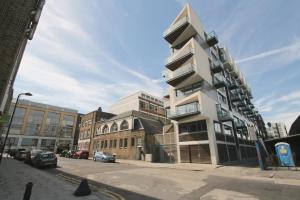 a tall white building on a city street at Double Room with Private Balcony in London