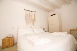 A bed or beds in a room at Casa Memi