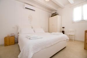 A bed or beds in a room at Casa Memi