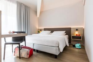 Postel nebo postele na pokoji v ubytování GoTì Hotel