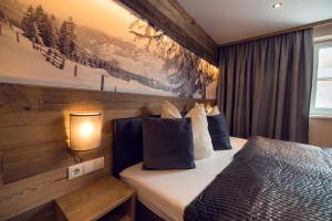 Postel nebo postele na pokoji v ubytování Chalet Arena