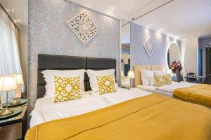 Ένα ή περισσότερα κρεβάτια σε δωμάτιο στο VIP Apartments Budapest Central