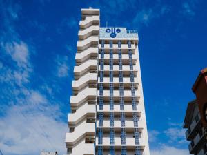 a tall white building with a csit sign on it at oile by DSH Resorts in Chatan