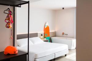 Postel nebo postele na pokoji v ubytování GoTì Hotel