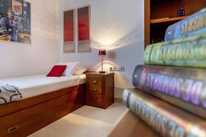 En eller flere senge i et værelse på Casa Marta