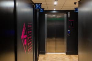 a elevator in a building with the number at Duke Street Boutique Hotel in Liverpool +36 photos