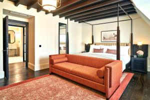 a living room with a couch and a bed at The Grand Hotel Birmingham in Birmingham