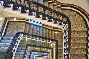 a row of stairs leading up to a stair case at The Grand Hotel Birmingham in Birmingham