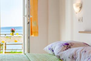 Postel nebo postele na pokoji v ubytování Rooms Sani