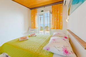 Postel nebo postele na pokoji v ubytování Rooms Sani