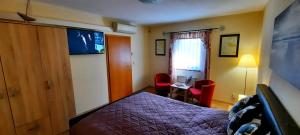 Łóżko lub łóżka w pokoju w obiekcie Pool Apartments