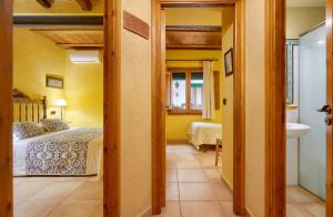 A bed or beds in a room at Casa Rural Can Coll