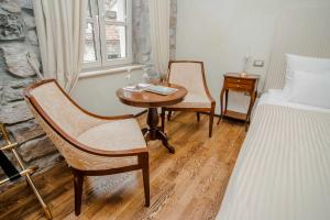 Katil atau katil-katil dalam bilik di Boutique Hotel Astoria
