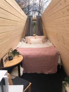 a bedroom with a bed in a tent at Niiralan Tila : Starlite Cabin in Laitila