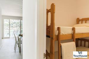 Ein Bett oder Betten in einem Zimmer der Unterkunft YourHouse Es Niu, apartment in Puerto de Sóller