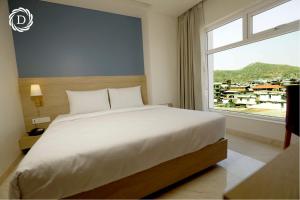 Ένα ή περισσότερα κρεβάτια σε δωμάτιο στο Hotel Daani Continental +15 φωτογραφίες