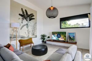 Posezení v ubytování Villa Paloma 4 étoiles avec Piscine et Vue exceptionnelle sur l'ocean à Saint-Leu