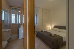 Posteľ alebo postele v izbe v ubytovaní Apartment N central
