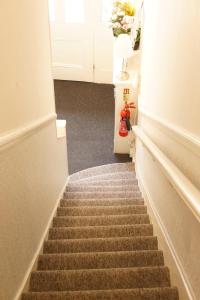 a staircase in a room with a stair case at Plaza Hotel in London