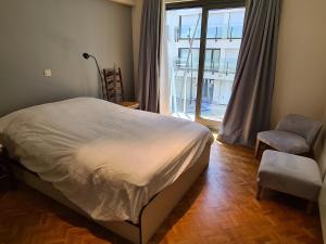 Giường trong phòng chung tại Oostduinkerke Apartments