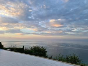 a view of the ocean under a cloudy sky at Villa Tatalia, Bozhurets in Bozhurets