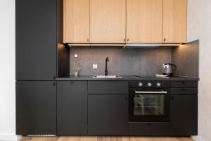 Kuchyň nebo kuchyňský kout v ubytování Apartamenty Letnicka by Noclegi Renters