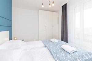 Postel nebo postele na pokoji v ubytování Apartamenty Letnicka by Noclegi Renters